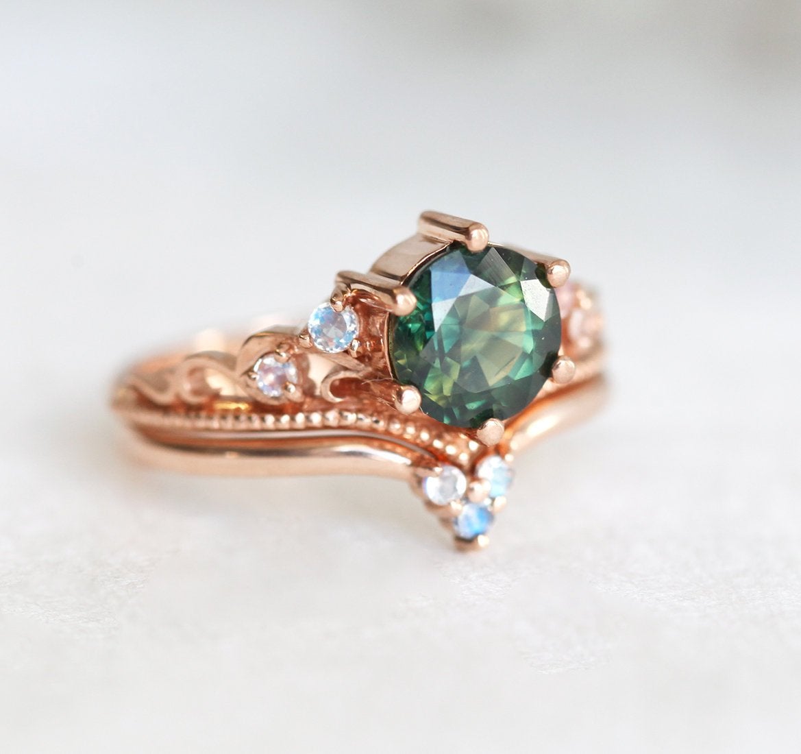 Round green vintage sapphire ring with side moonstones