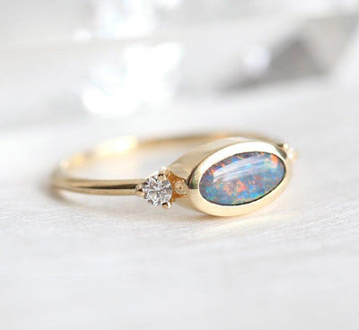 Three-Stone Oval Black Opal Ring with 2 Side White Diamonds