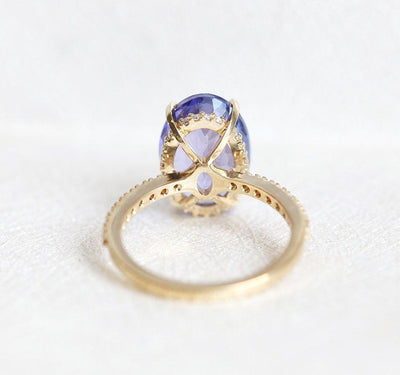 Purple Oval Tanzanite Yellow Gold Ring with Round White Diamonds Nested in the Band