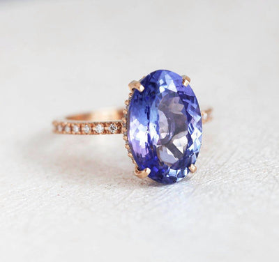 Purple Oval Tanzanite Rose Gold Ring with Round White Diamonds Nested in the Band