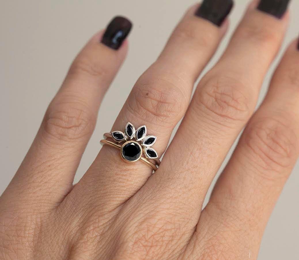 Stacked black marquise-cut diamond ring in floral setting