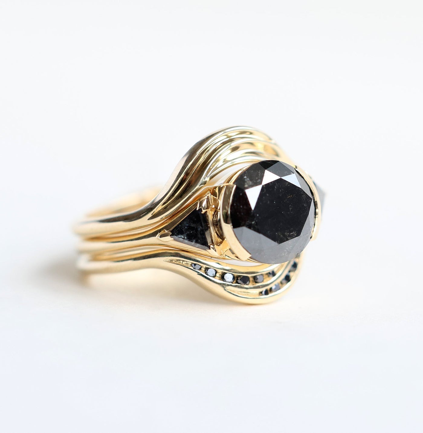 3-Stone Round Black Diamond Ring with 2 Side Triangle Cut Black Diamonds and Diamond Nesting Band