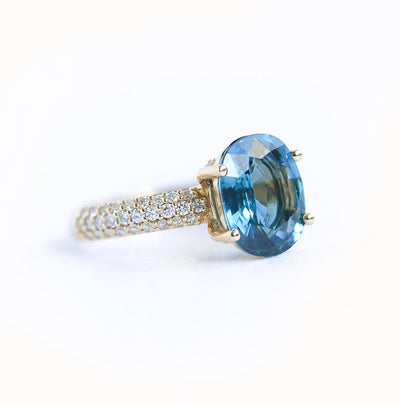 Blue oval-shaped cushion sapphire ring