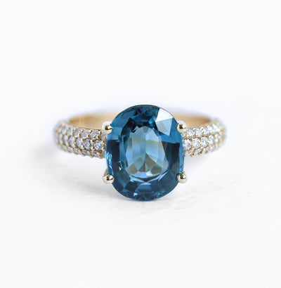 Blue oval-shaped cushion sapphire ring