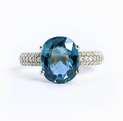 Blue oval-shaped cushion sapphire ring