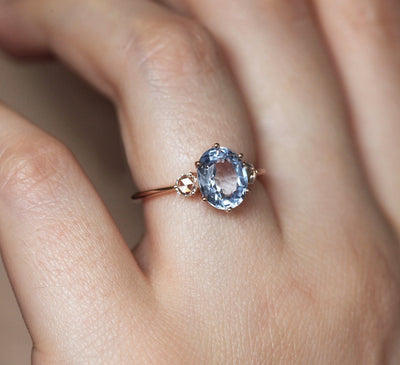 Blue oval sapphire ring with side diamonds