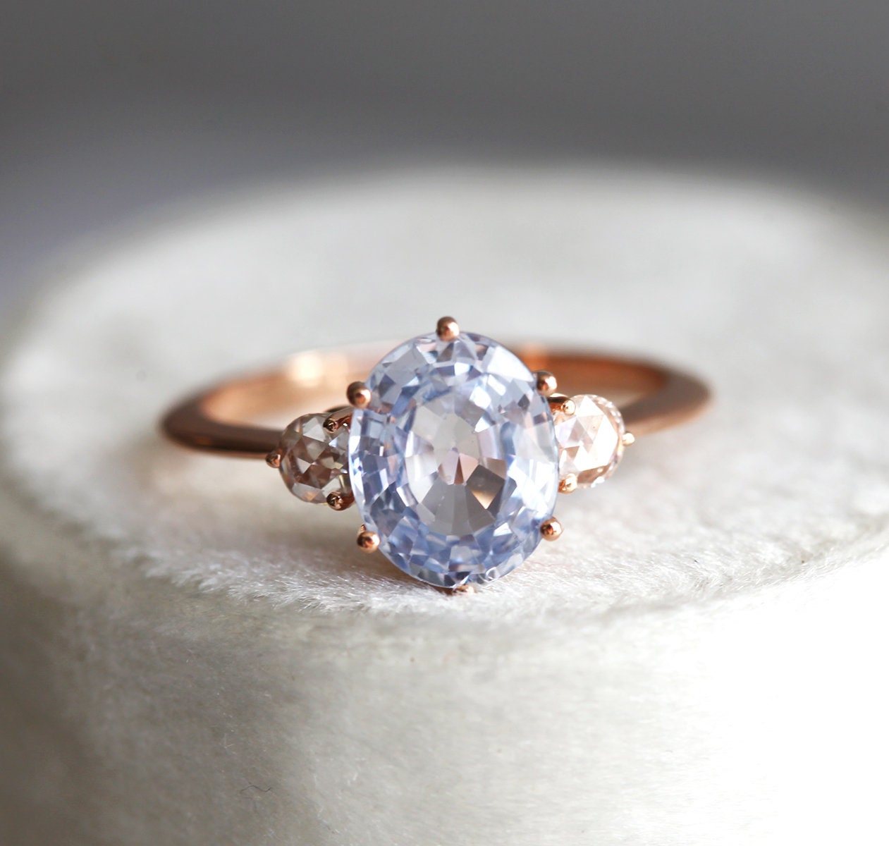 Blue oval sapphire ring with side diamonds