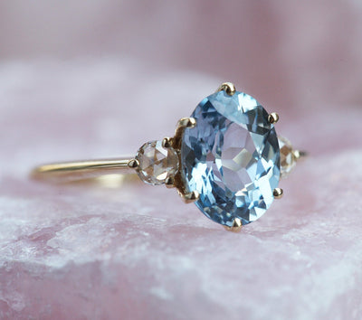 Blue oval sapphire ring with side diamonds