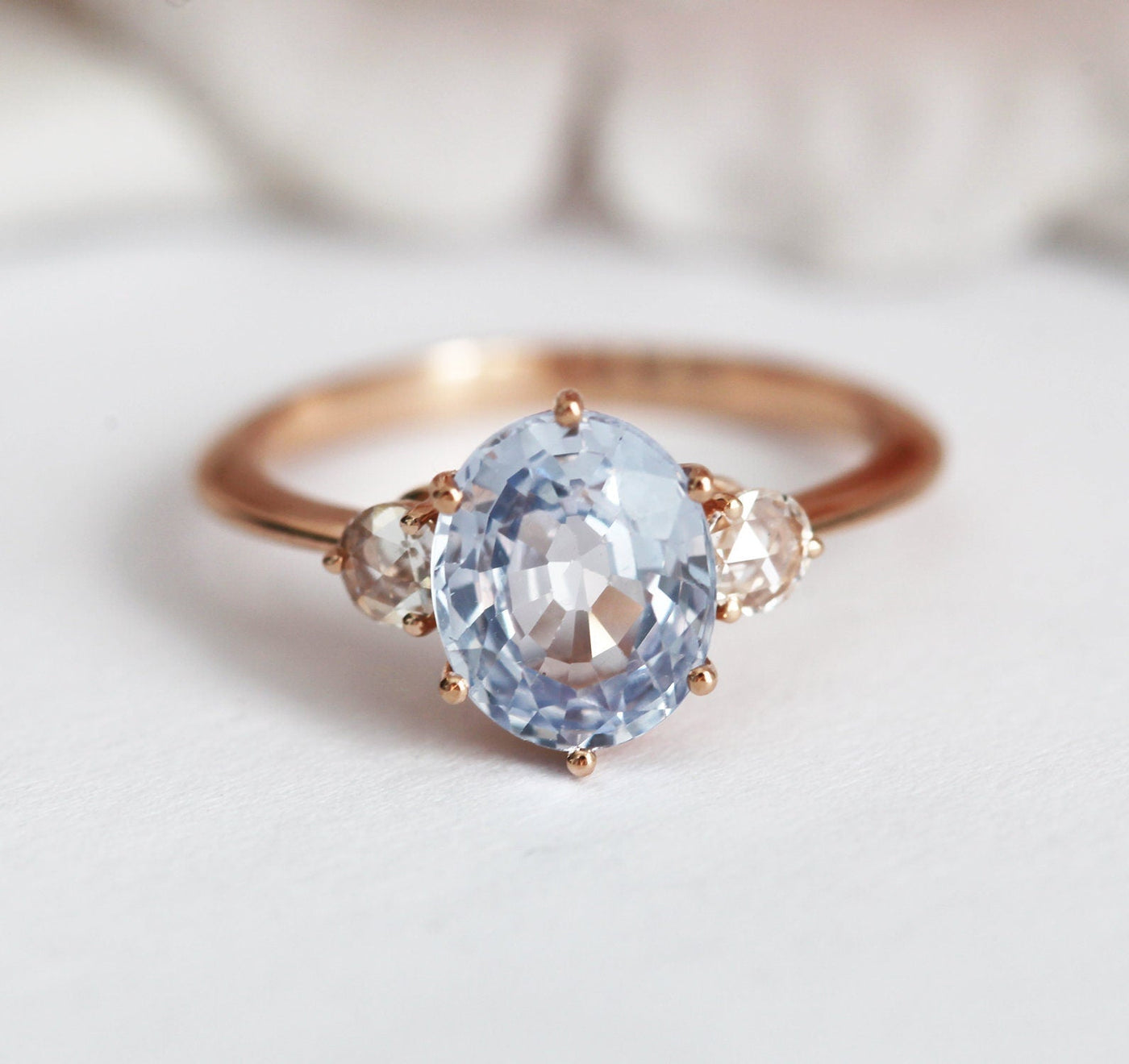 Blue oval sapphire ring with side diamonds