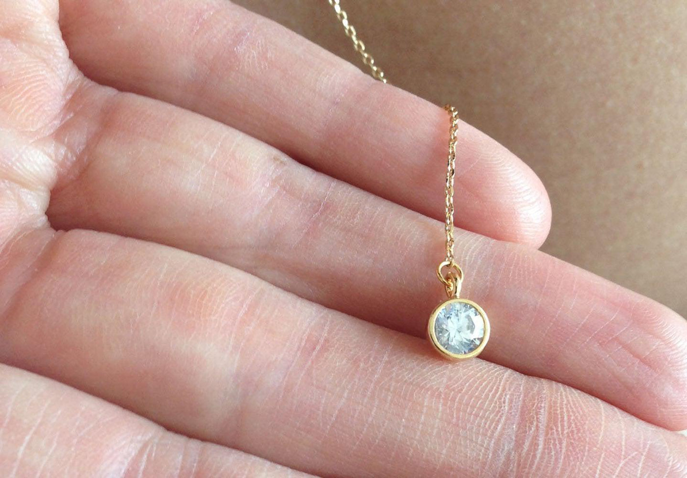 Gold body chain necklace with round white diamond drop