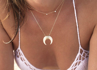 White horn crescent moon gold necklace