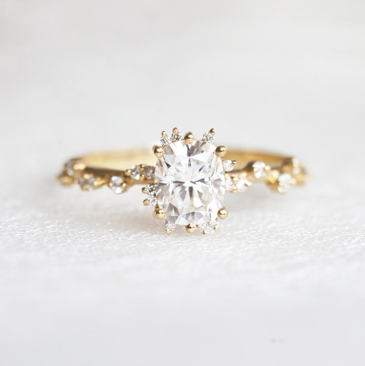 Oval White Diamond Cluster Ring with Side White Round Diamonds Placed like a vine leading to the center stone