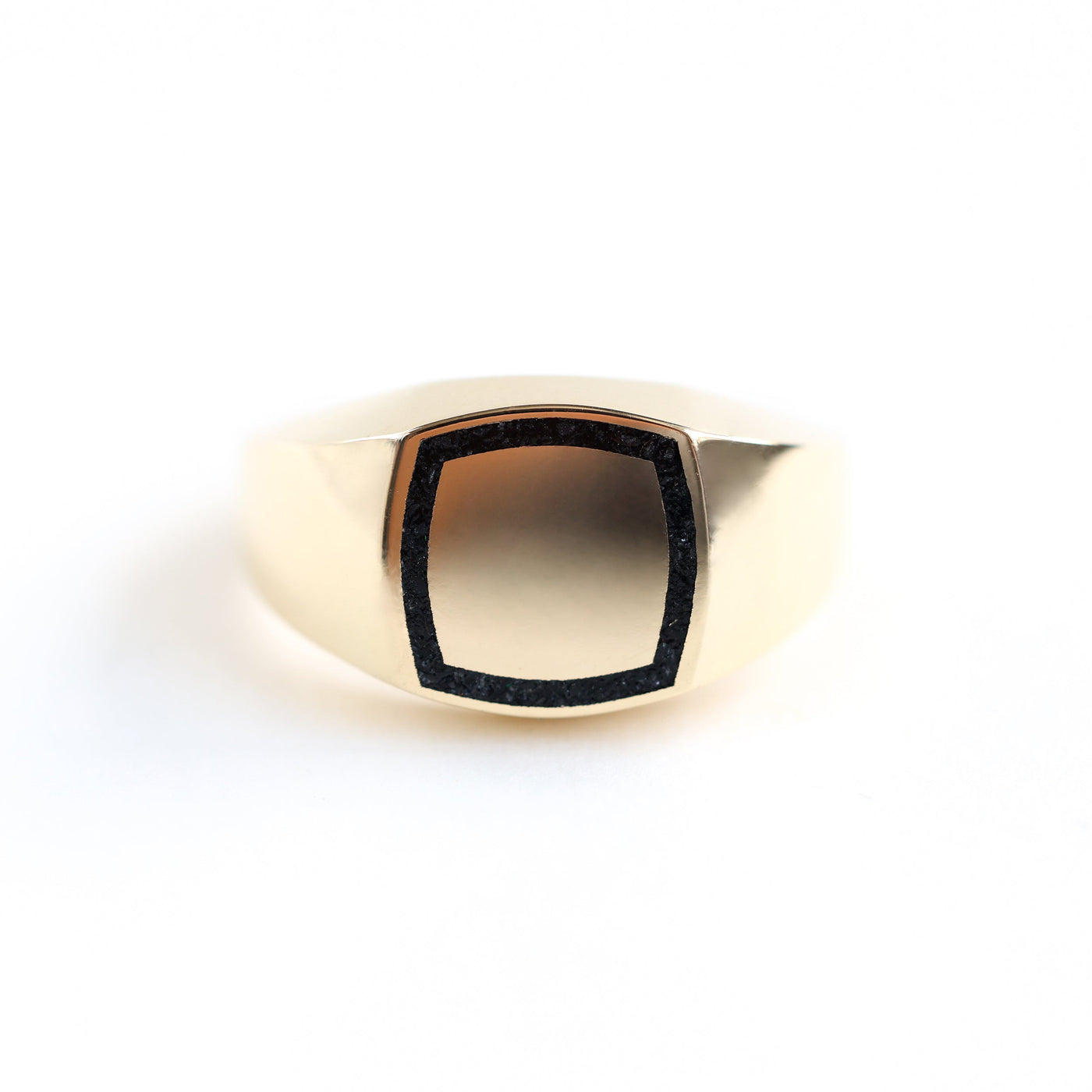 Close-up of a Brad gold inlay signet ring showcasing its intricate details.