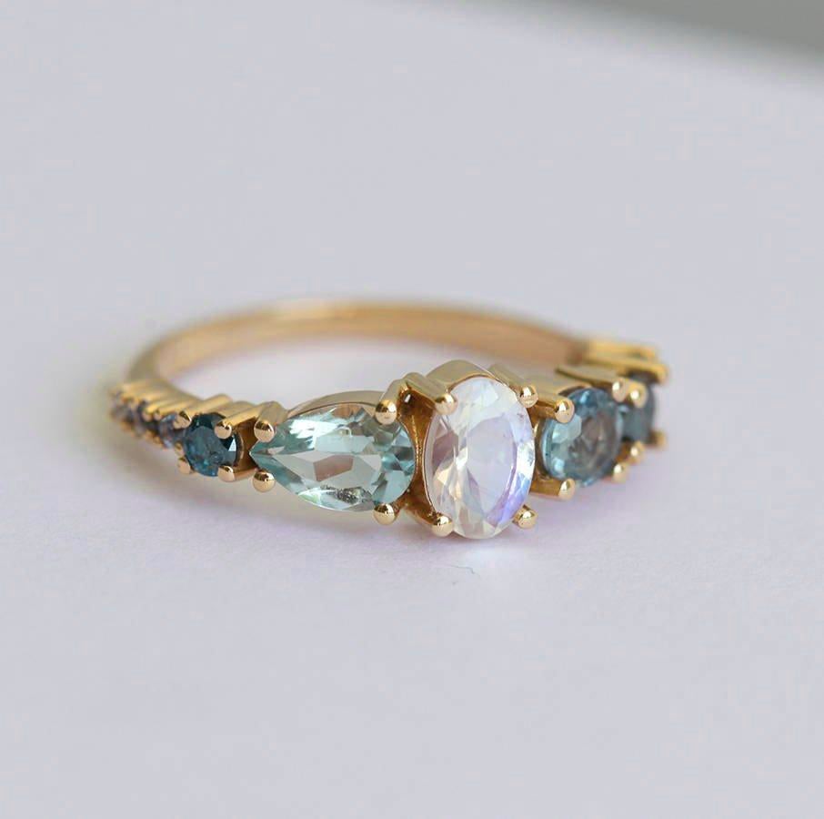 Oval Moonstone Cluster Ring with Pear Aquamarine, Round Sapphire Stones and Blue Diamonds