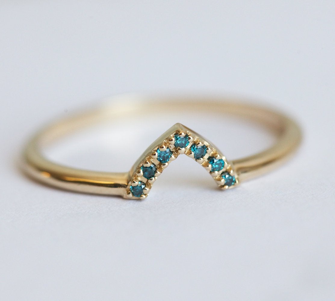 Trillion-shaped teal sapphire ring with nested diamonds