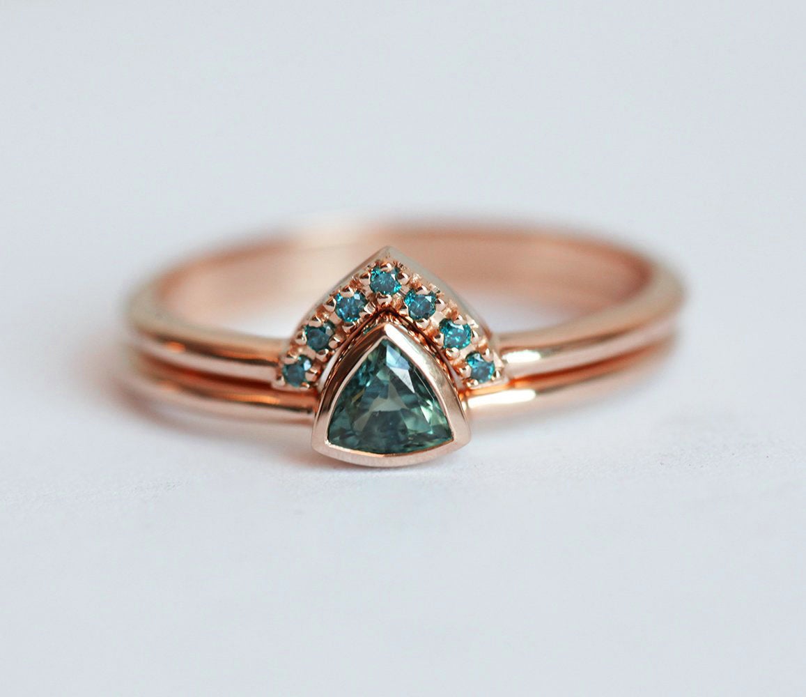 Trillion-shaped teal sapphire ring with nested diamonds