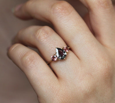 Pear-shaped burgundy sapphire ring with side garnets