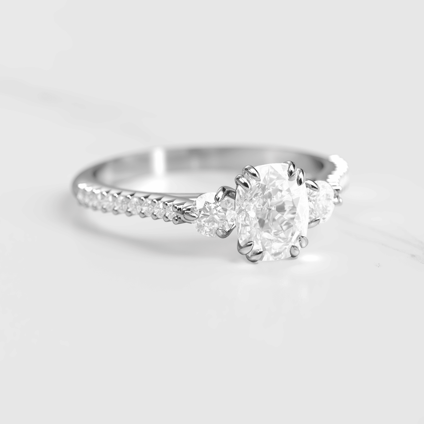 Cushion-Cut White Diamond with 2 Side Diamonds and Half Pave Gold Ring
