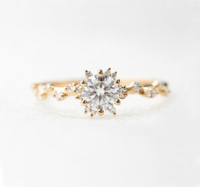 Round White Diamond Cluster Ring with Side White Round Diamonds Placed like a vine leading to the center stone