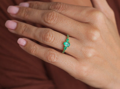 Oval Emerald Cluster Ring with 2 Horizontal Placed Pear Emeralds and Emeralds on the Band