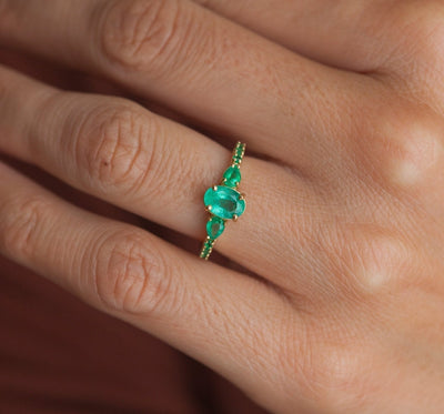 Oval Emerald Cluster Ring with 2 Horizontal Placed Pear Emeralds and Emeralds on the Band