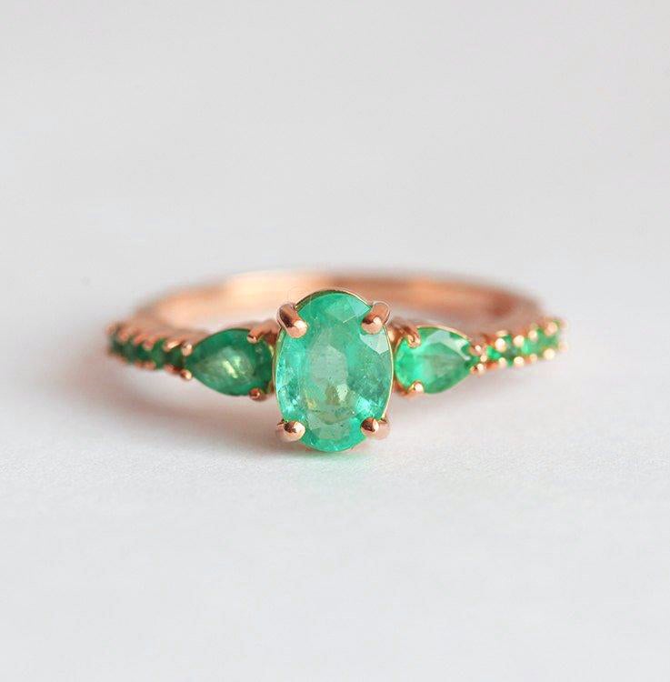 Oval Emerald Cluster Ring with 2 Horizontal Placed Pear Emeralds and Emeralds on the Band