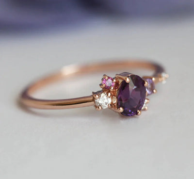 Purple oval sapphire ring with cluster diamonds and amethyst