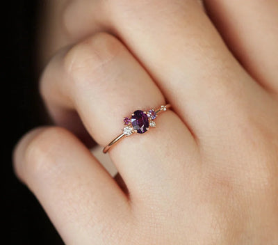 Purple oval sapphire ring with cluster diamonds and amethyst