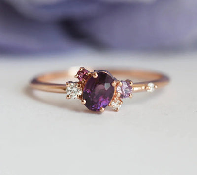 Purple oval sapphire ring with cluster diamonds and amethyst