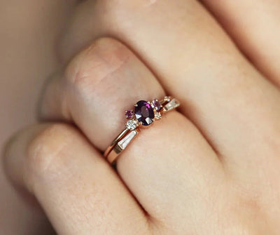 Purple oval sapphire ring with cluster diamonds and amethyst