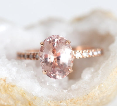 Pink oval sapphire ring with side diamonds