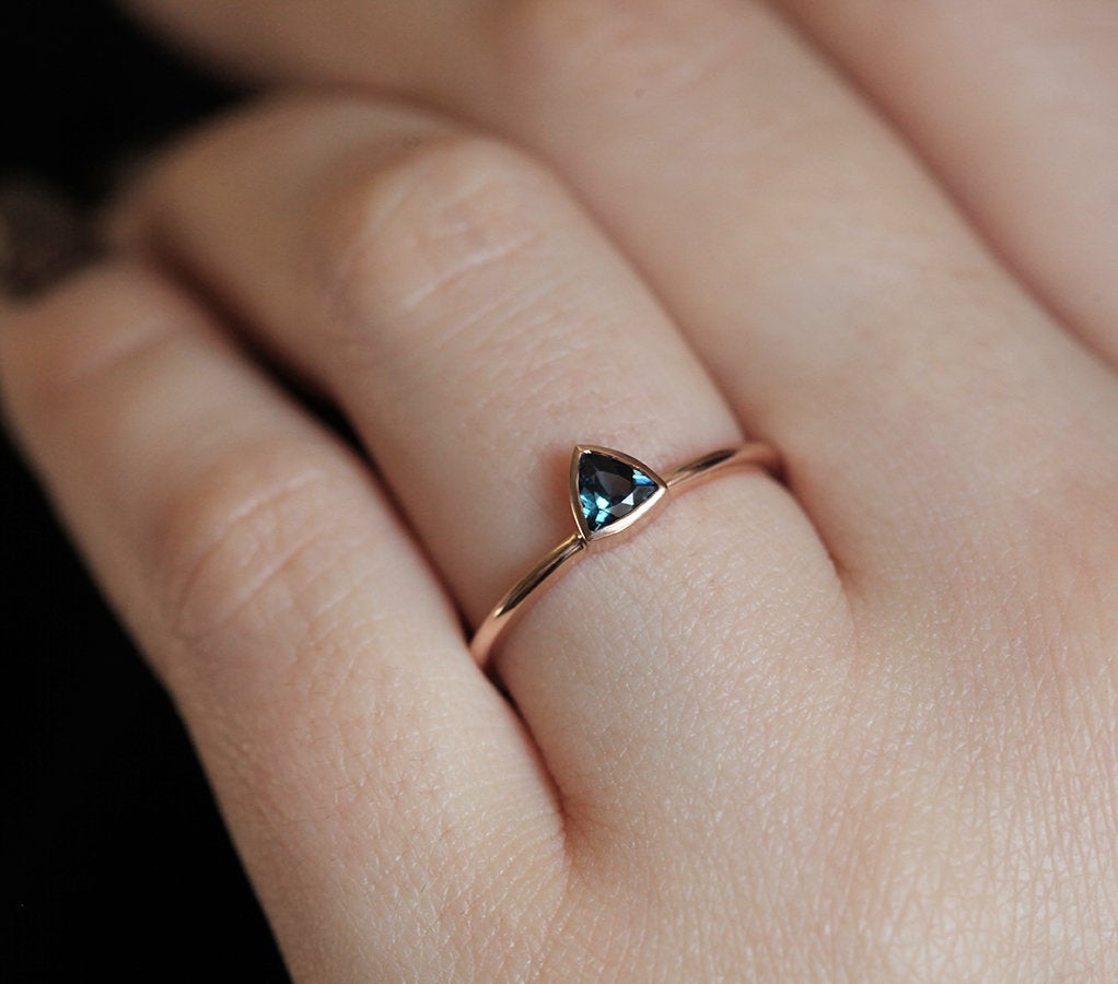 Trillion-shaped teal sapphire ring