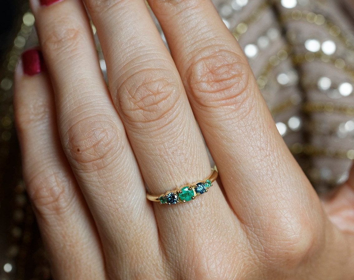 Round Emerald Cluster Ring with 2 Side Blue Diamonds and 2 Side Round Emeralds