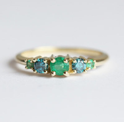 Round Emerald Cluster Ring with 2 Side Blue Diamonds and 2 Side Round Emeralds