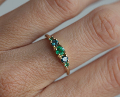 Round Emerald Cluster Ring with 2 Side Blue Diamonds and 2 Side Round Emeralds