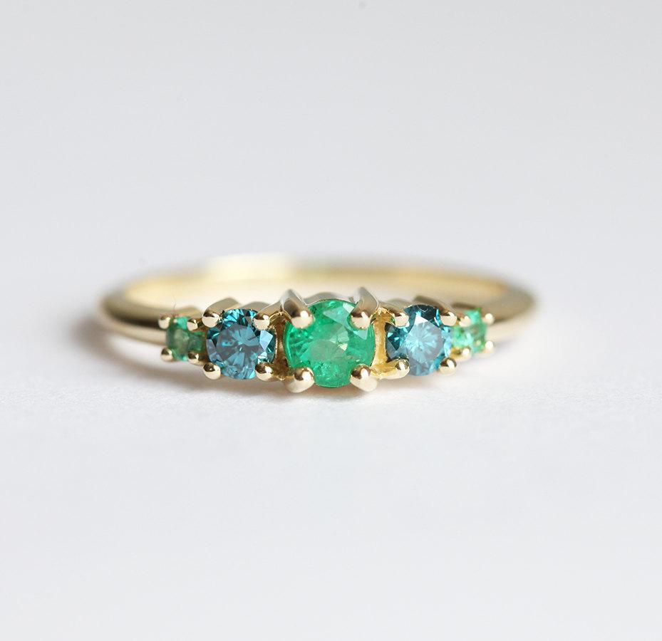 Round Emerald Cluster Ring with 2 Side Blue Diamonds and 2 Side Round Emeralds