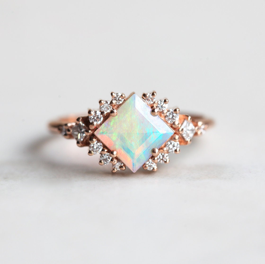 Square Opal Halo Ring with Princess-Cut and Round White Diamonds Surrounding The Centerpiece Gemstone