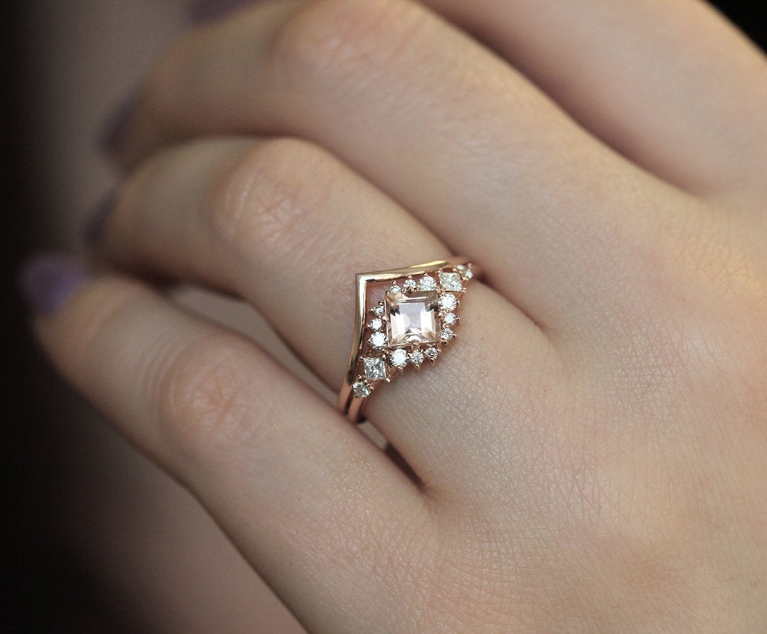 Square-shaped peach pink sapphire ring with diamond cluster