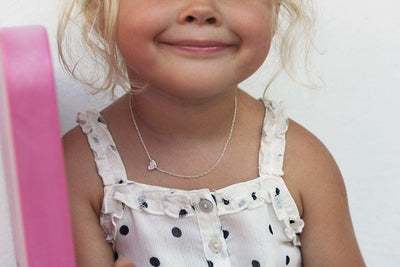 Heart-shaped gold child's necklace with round white diamond