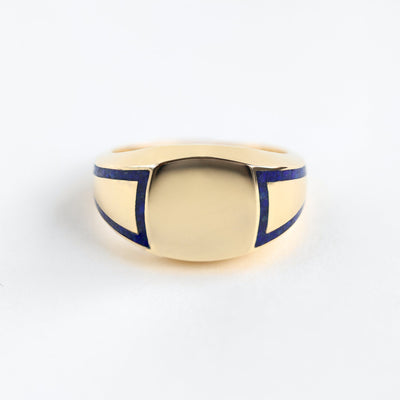 Gold inlay band ring with lapis lazuli gemstone, polished finish. Customizable design.