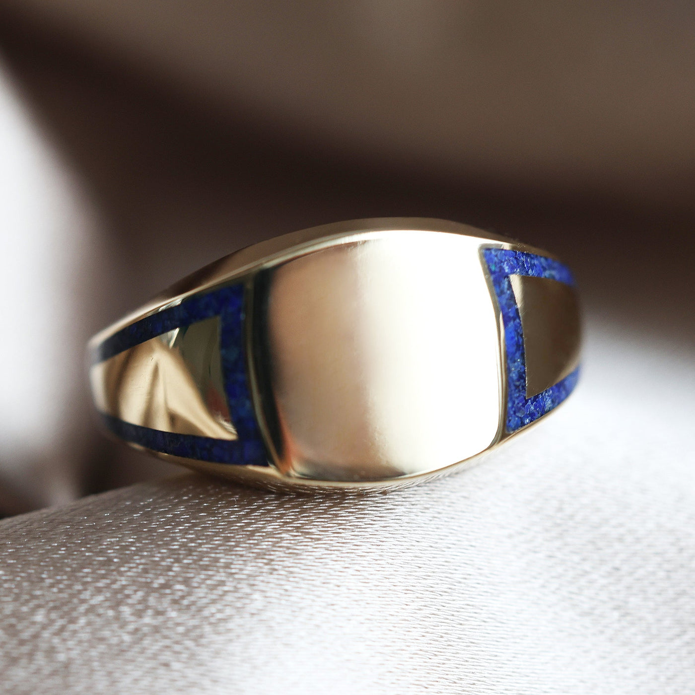 Gold ring with lapis lazuli inlay, 11mm front width, polished finish. Made of 14k & 18k gold or platinum.