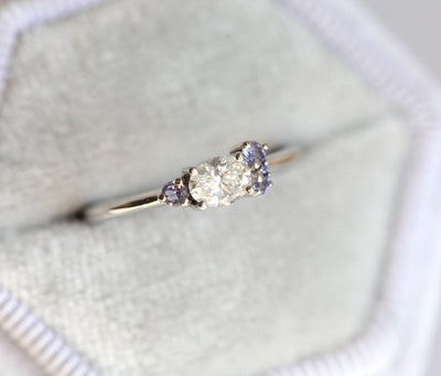 Oval White Diamond Cluster Ring with 4 Round Side Tanzanites