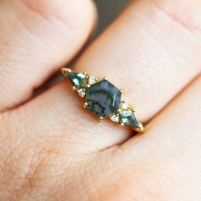 Cluster Moss Agate Ring on hand, featuring hexagon-shaped green moss agate with diamonds.