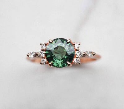 Round green sapphire ring with diamond cluster