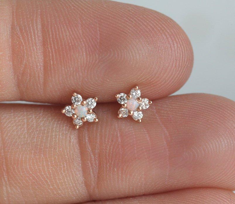 Round white opal stud earrings with side diamonds