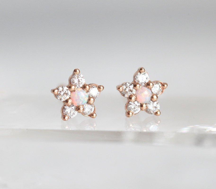 Round white opal stud earrings with side diamonds