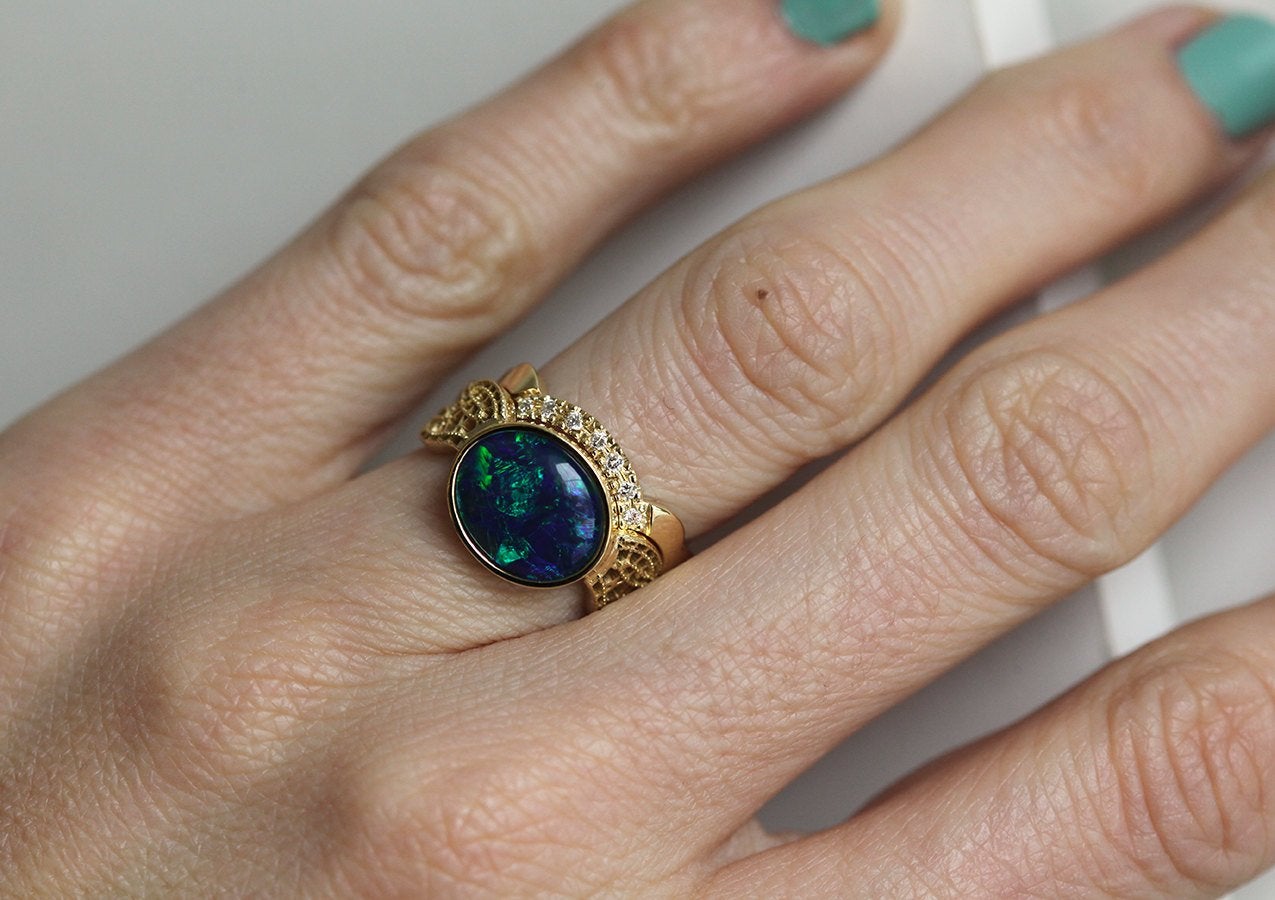 Black Oval Opal Gold Ring Set with Opal as Centerpiece Adorned By Vintage Lace On The Sides And A Diamond Lace Band