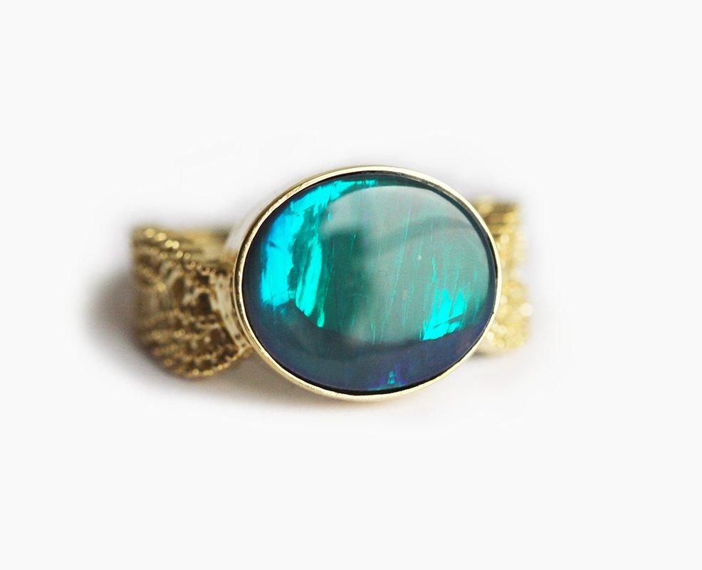 Black Oval Opal Gold Ring with Opal as Centerpiece Adorned By Vintage Lace On The Sides