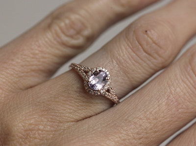 Oval lavender sapphire ring with diamond halo