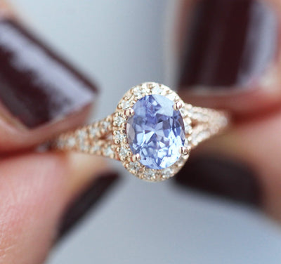 Oval lavender sapphire ring with diamond halo